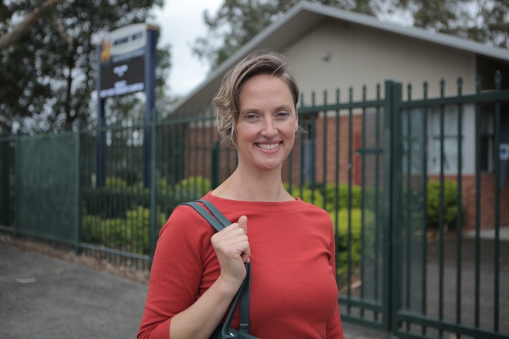 A woman smiling at the camera