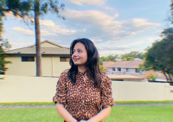 Student in yard looking to the left