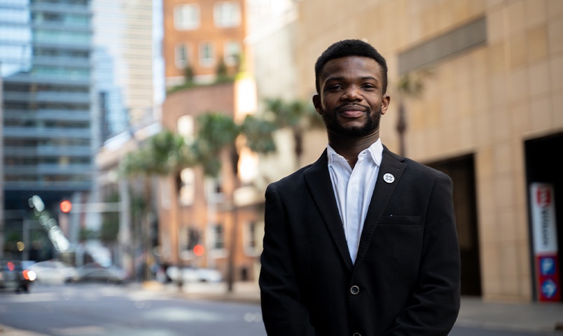 Man in suit standing in city street