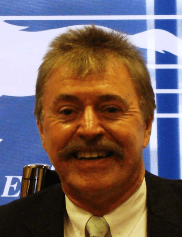 Headshot of man with moustache