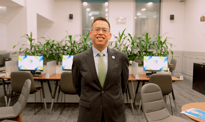 Man in suit smiling at camera
