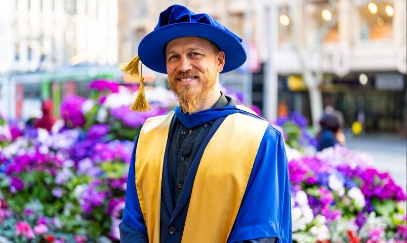 Male in graduation cap and robe