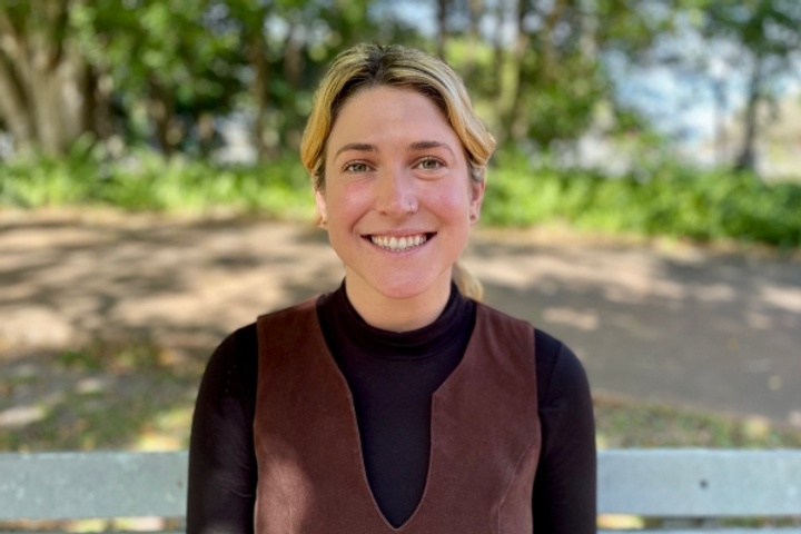 A woman smiling at the camera