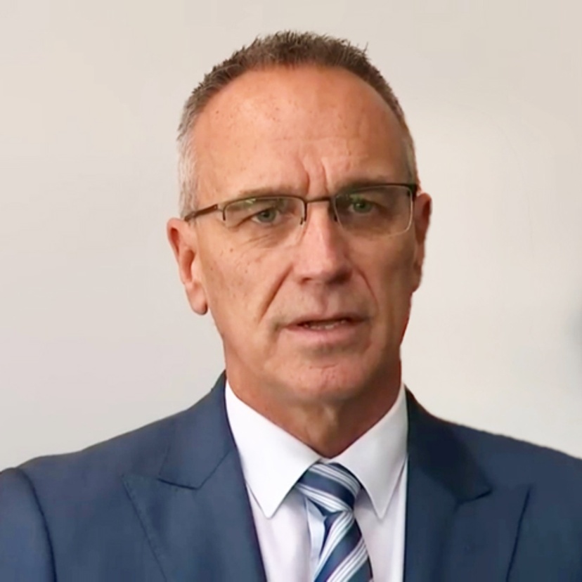 head and shoulders of John Lewis a man wearing a suit and tie