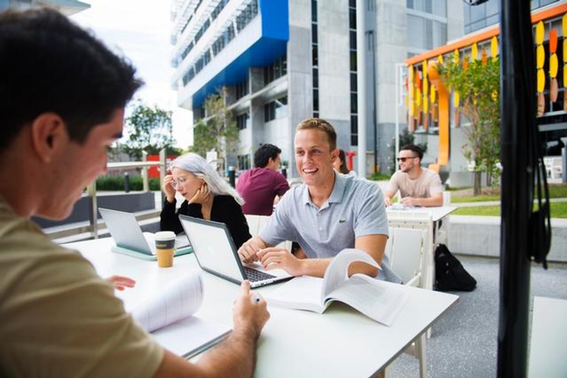 Student sitting at Green room with laptop