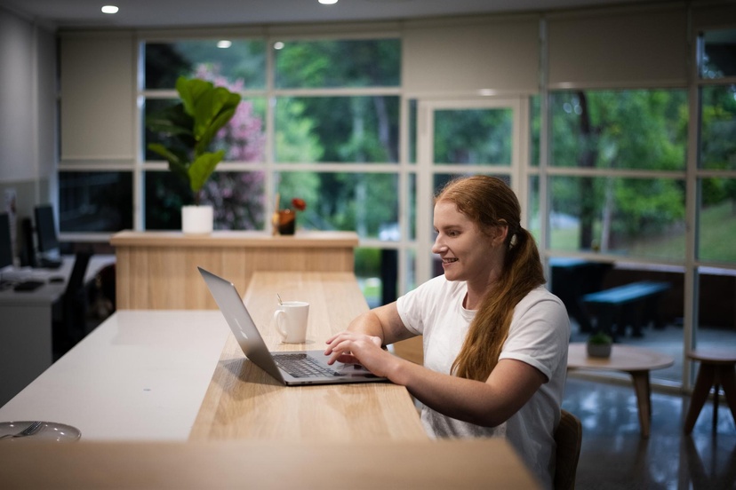 A student sits in front of a laptop.