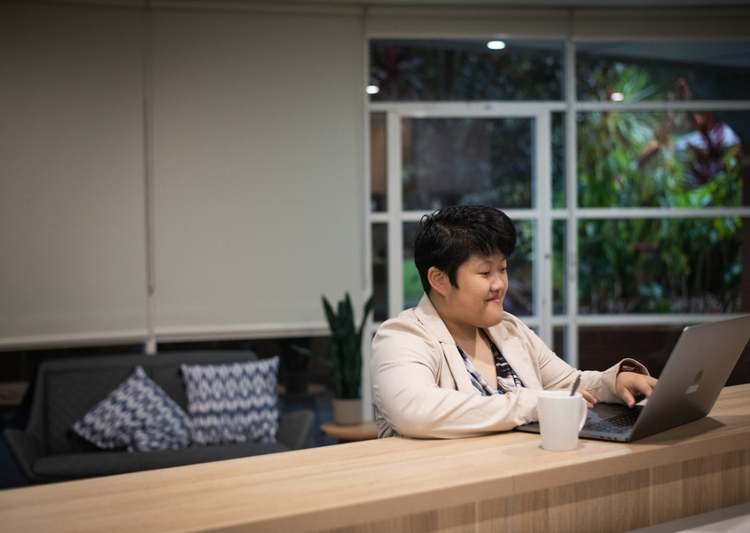 A student works on a laptop at home