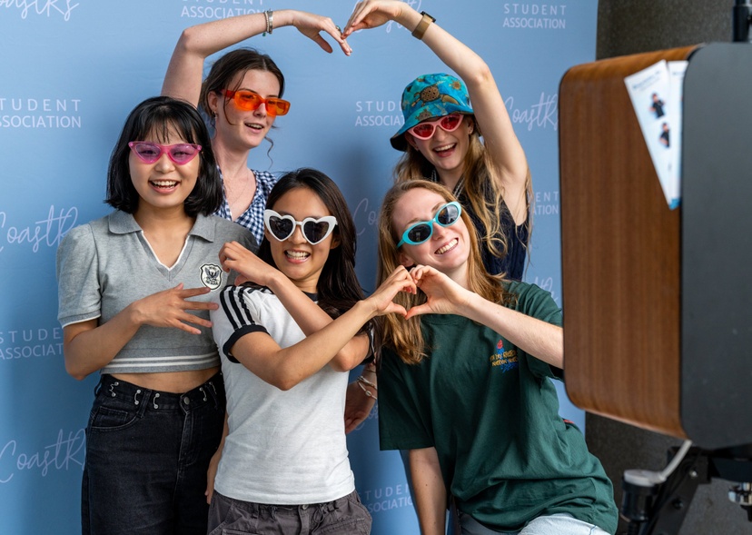 Five students take a photo together at Orientation.