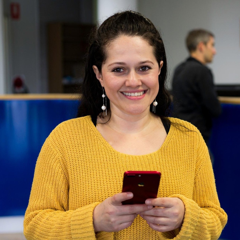 student holding phone