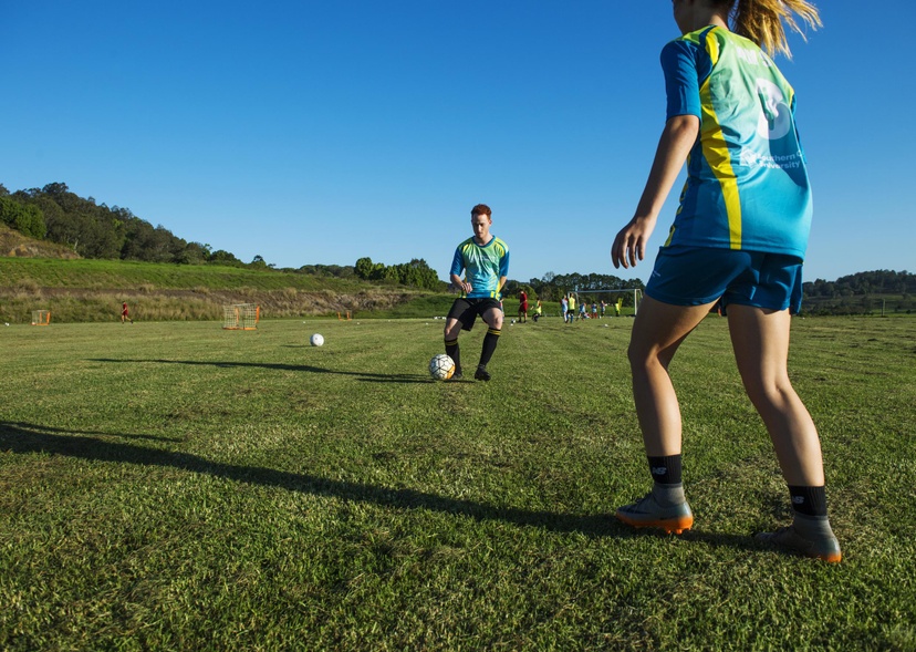 two people playing football