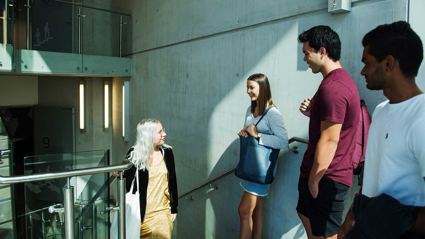Group of students chatting in the hallway