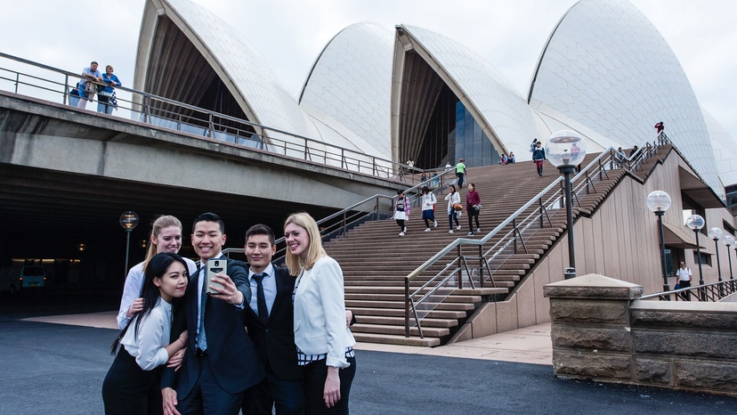 Group of students posing for a group photo with the Sydney Opera House in the background