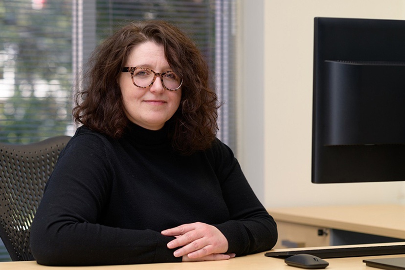Professor Alison Pullen sitting at desk