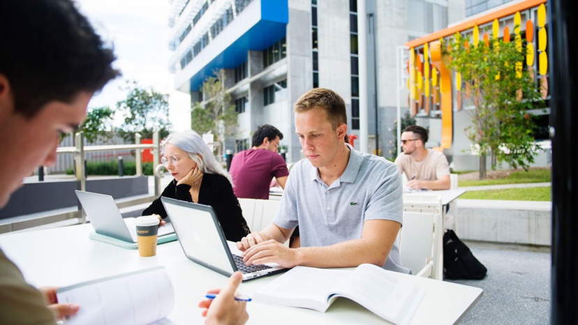 Students studying outdoors at the Gold Coast campus