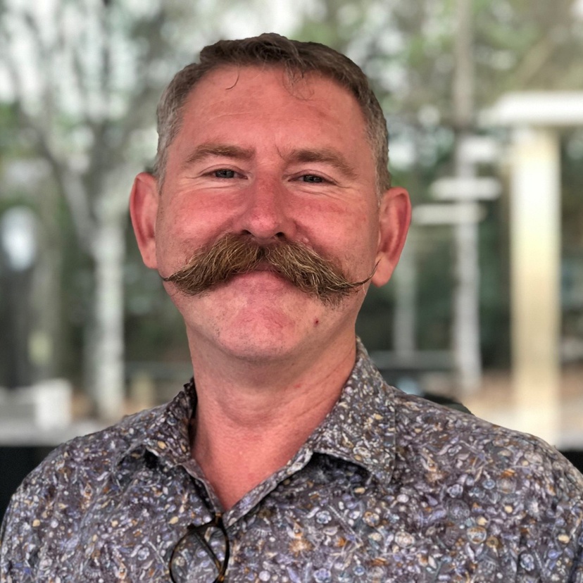 Head and shoulders of man with moustache