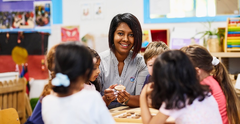 Early childhood teacher in class with children