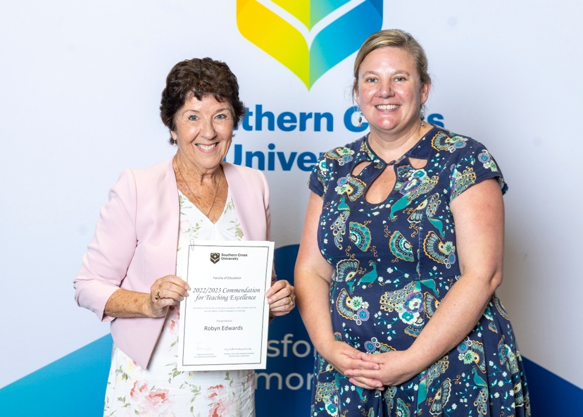 Robyn Edwards receiving an award from Prof Cutter-Mackenzie-Knowles