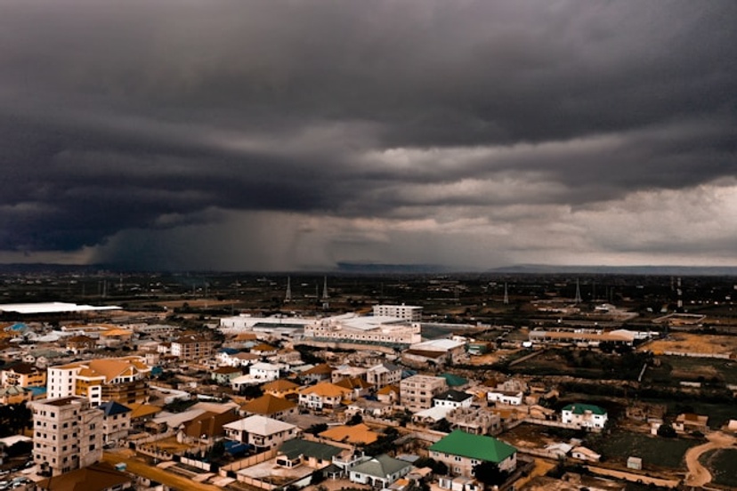 City with storm clouds and rain overhead