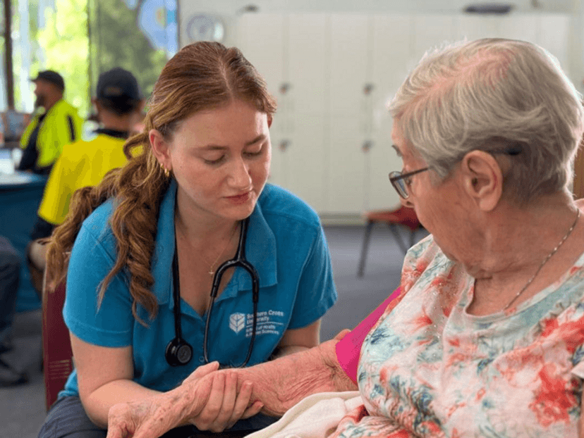 SCU Nursing student with a community member