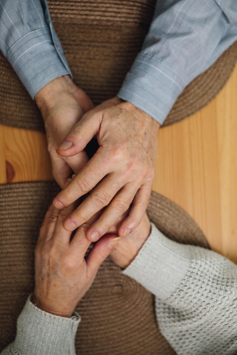 Two people holding hands