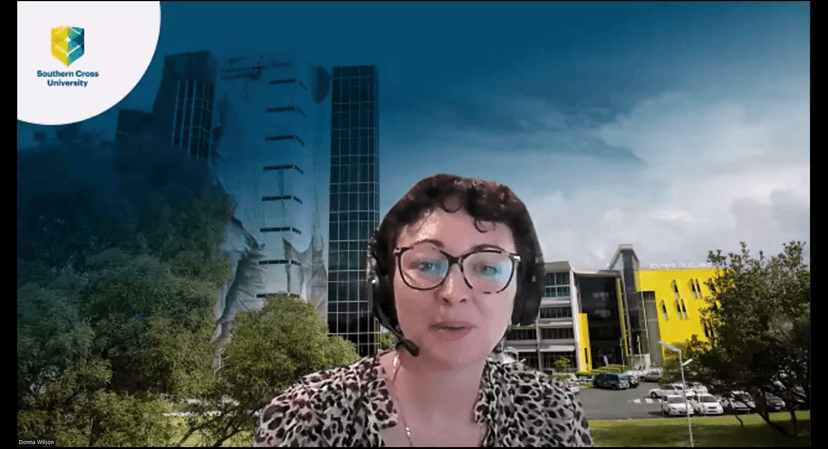 Woman with glasses with and wearing headset