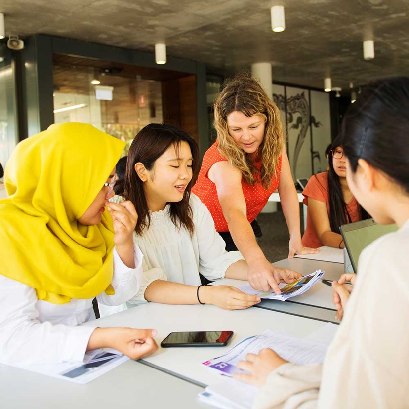 International english language students learning outside together