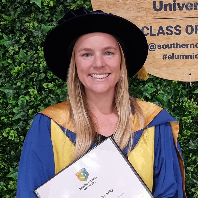 Head and shoulders of Dr Megan Kelly in academic gown