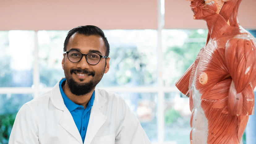 Nursing student with anatomy model