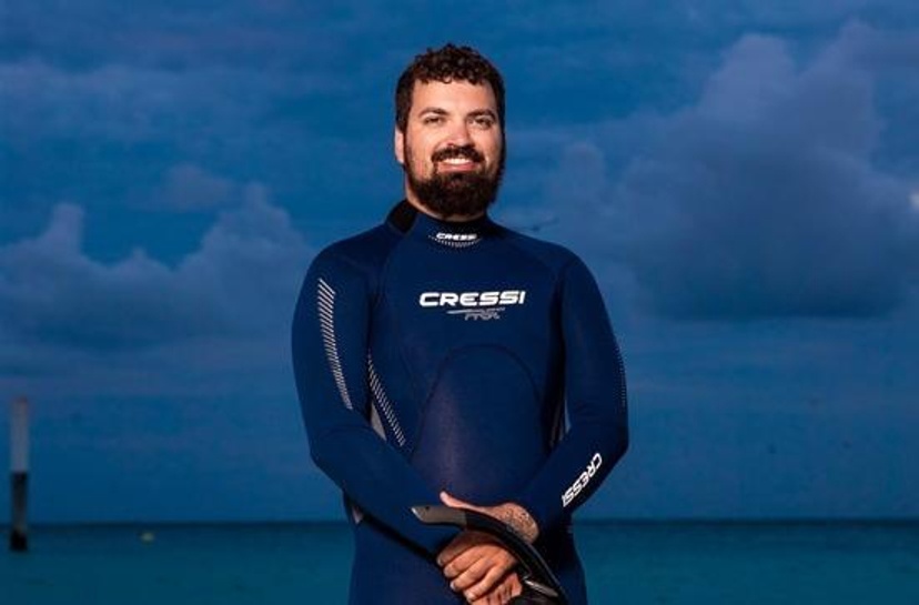 Jordan Ivey, PSP Graduate in wetsuit