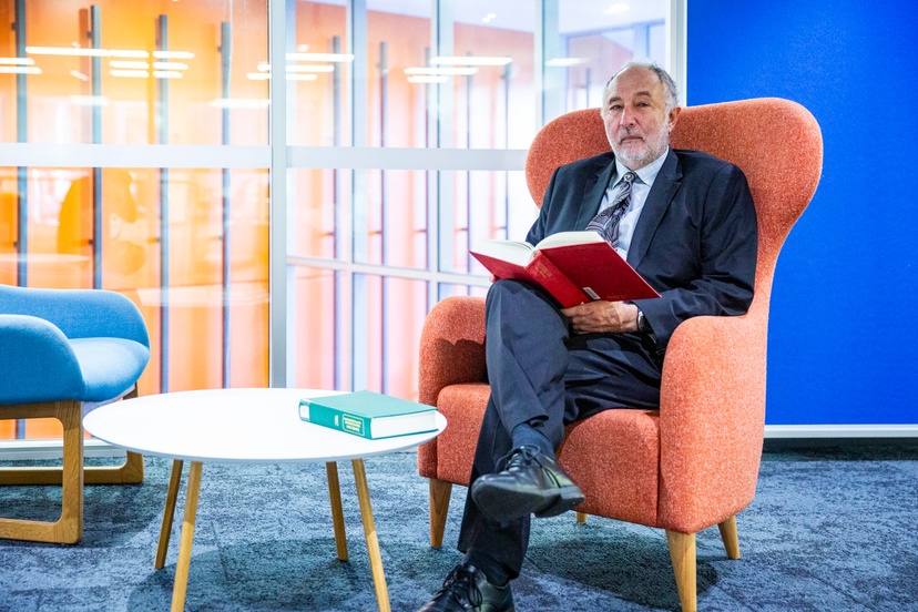 Man in chair with book