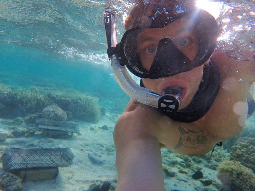 A male snorkelling underwater