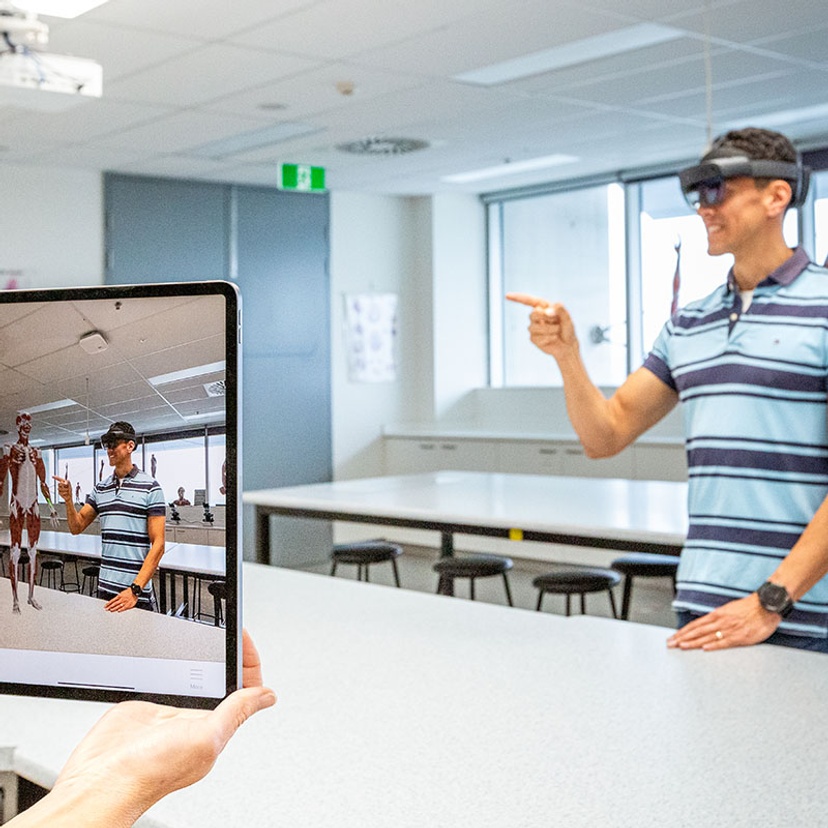 Student using mixed reality goggles in biomedical science laboratory