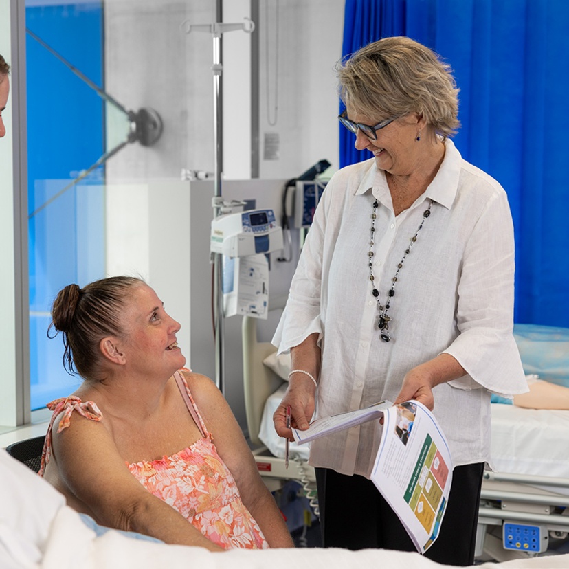 Associate Professor Christina Aggar in hospital setting with client/patient