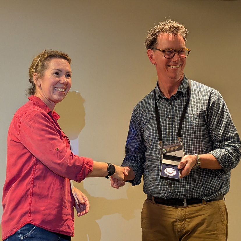 Professor Nigel Andrew receives Ian Mackerras Medal from AES president Dr Melinda Moir