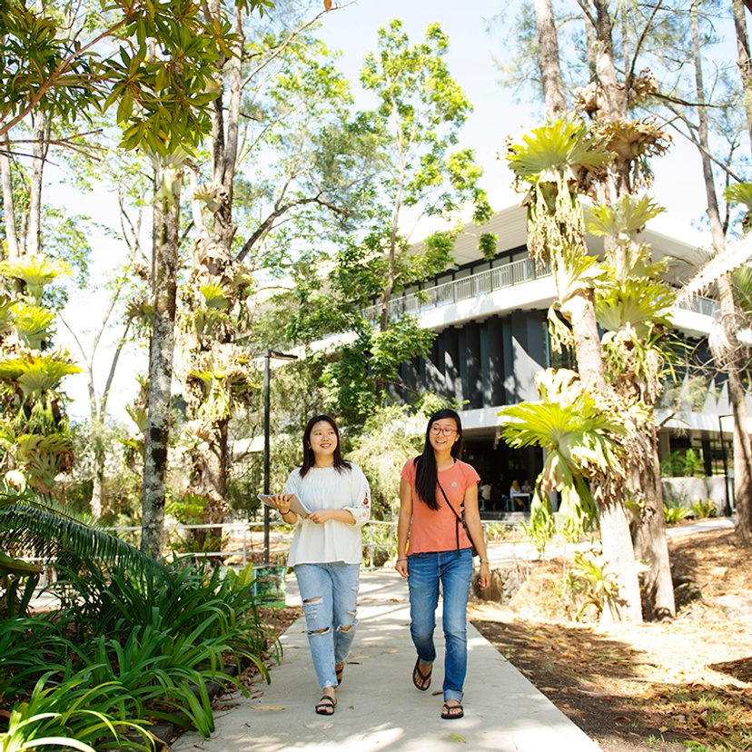 Two students walking on Northern Rivers campus