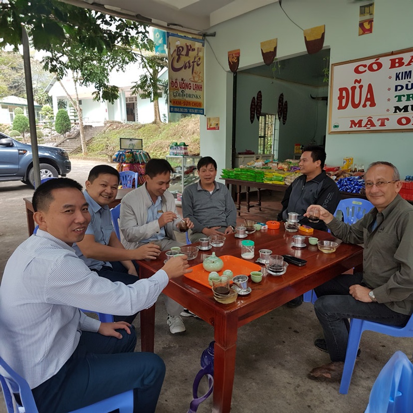 Les Christidis sitting with wildlife rangers in Vietnam