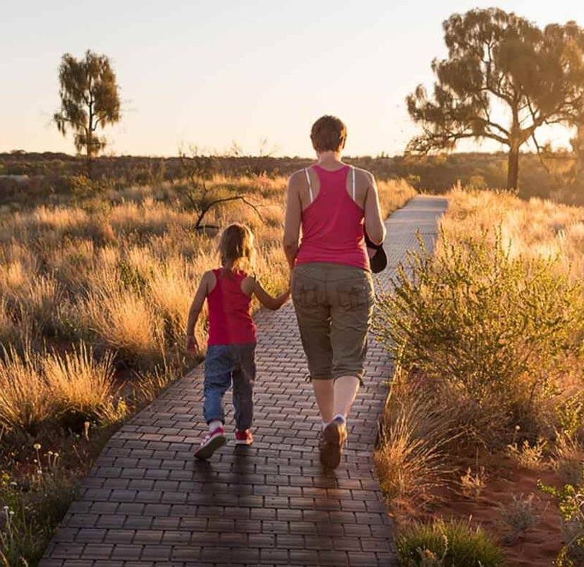 Carer walking with child