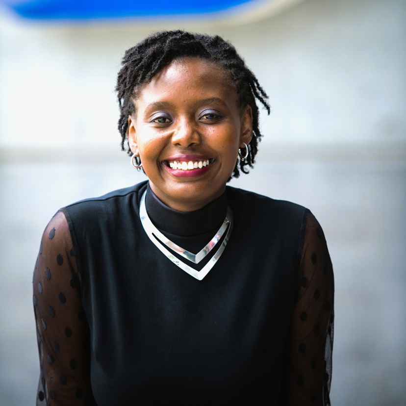 Head and shoulders of a smiling Adjunct Dr Kathomi Gatwiri