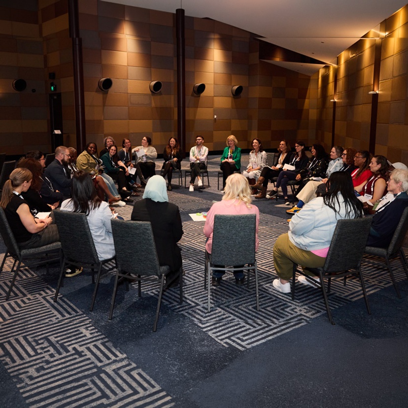 Group of people in a circle in discussion