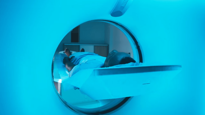 Patient on a bed entering an MRI machine
