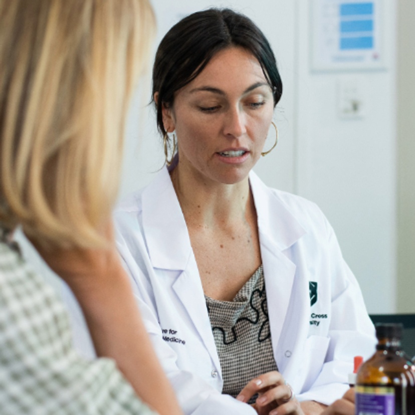 Female naturopath in consultation with a client