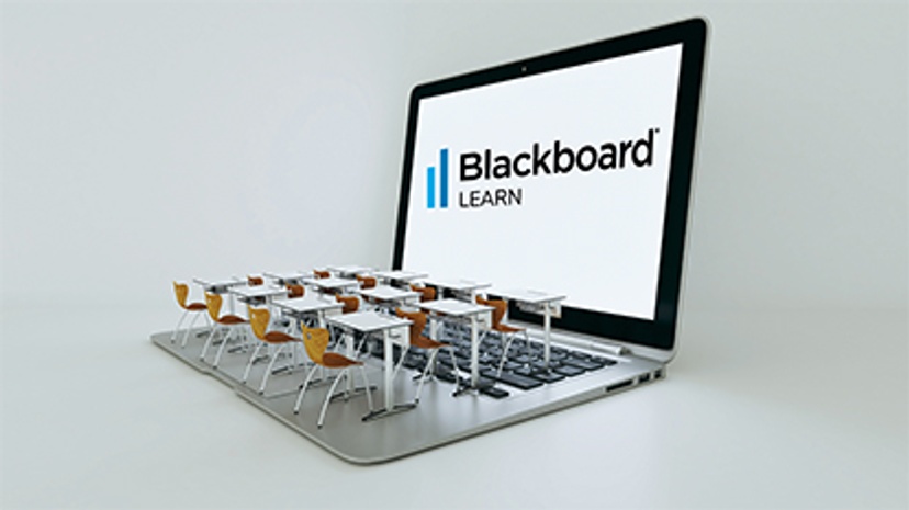 classroom desks on a laptop with Blackboard lgo on the screen