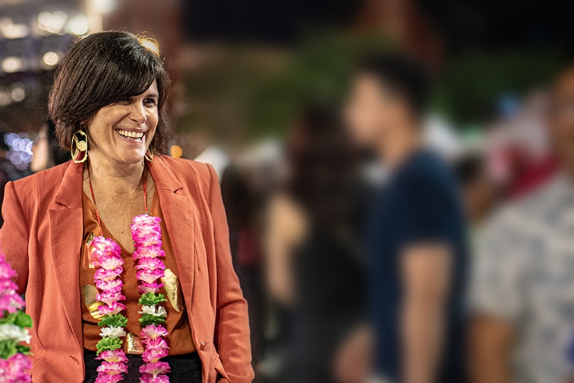 Female in orange jacket image background is blurred