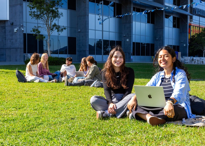 Students sitting on the lawn on the Gold Coast campus