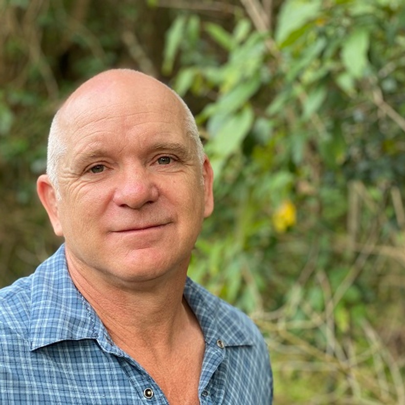 Man with forest in background