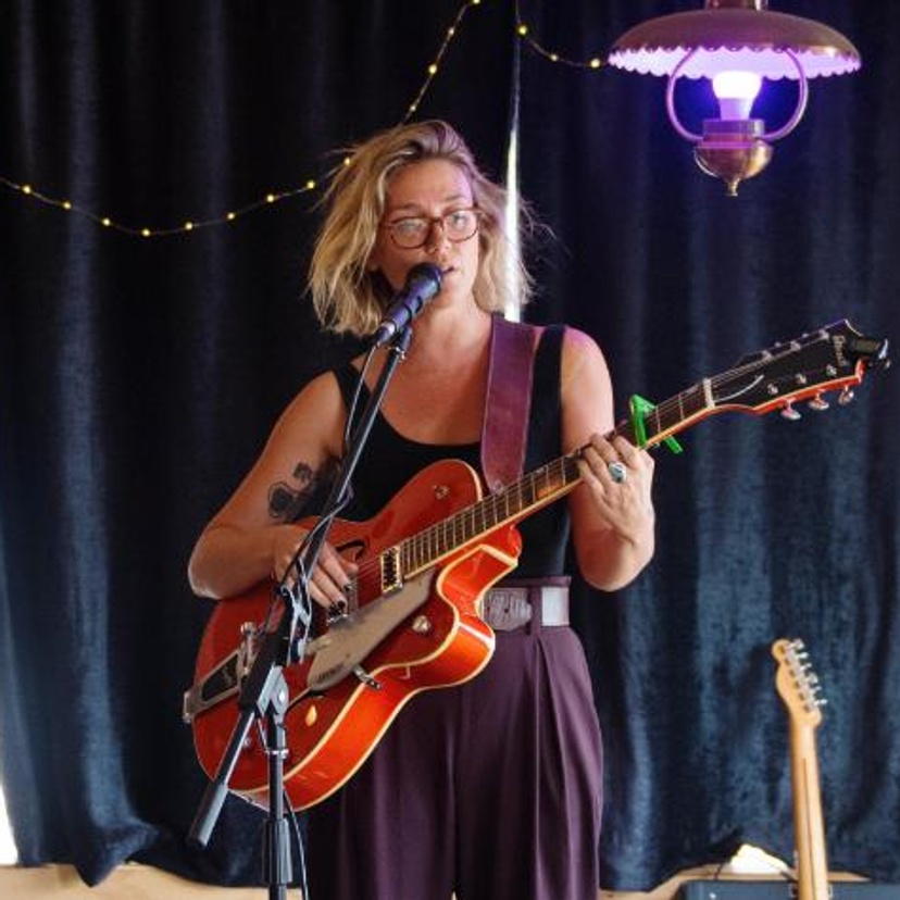 woman playing guitar