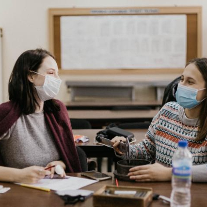 two female students with face masks on