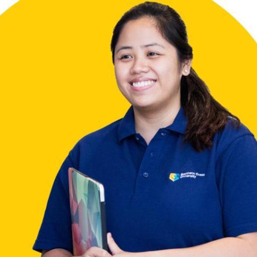 Female student with long dark hair wearing SCU polo shirt and holding laptop
