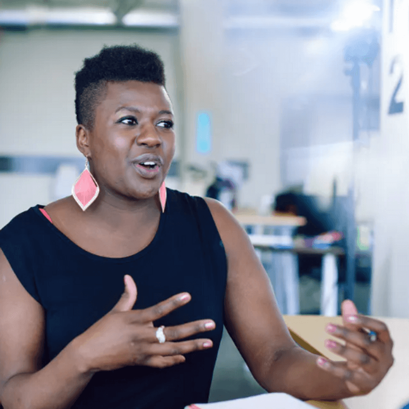 Black African woman talking to other people