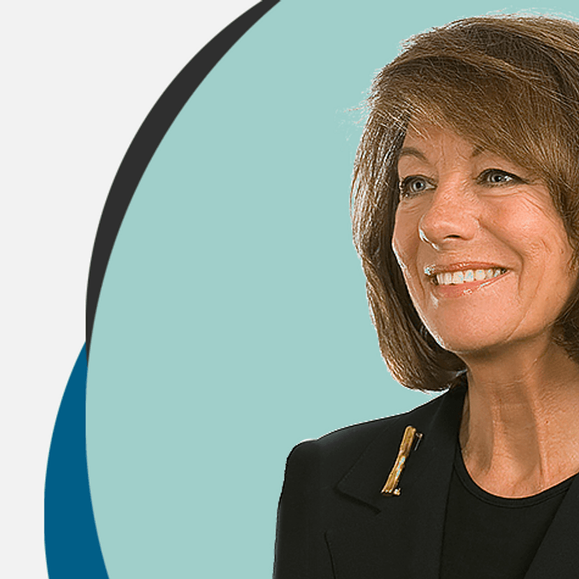 Woman in dark business clothes looking to the left